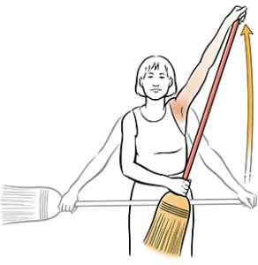 Woman doing broom stretch shoulder exercise.